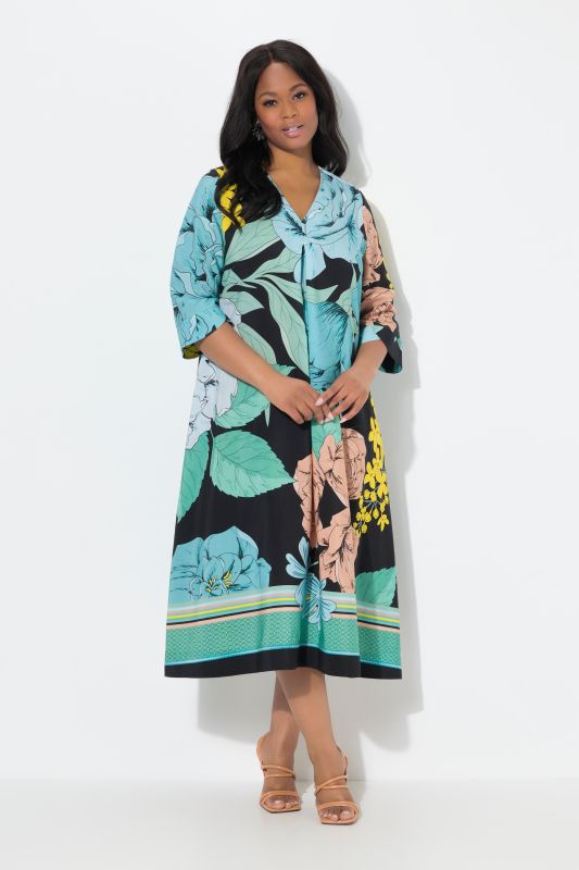 Robe midi en lyocell. Col en V et manches 3/4. Imprimé grandes fleurs. Coupe évasée