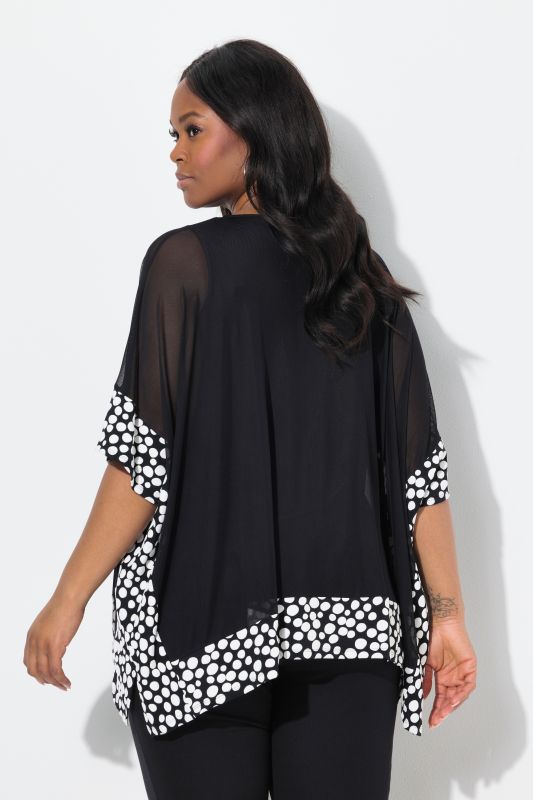 Blouse en mousseline, pois floqués. Col en V et manches 3/4