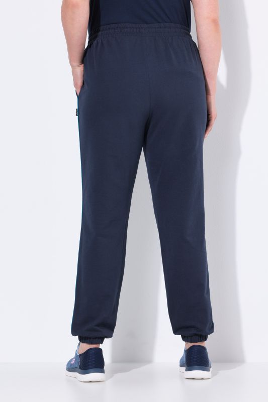 Pantalon de jogging, taille et bas de jambe élastiques, passepoil sur les côtés