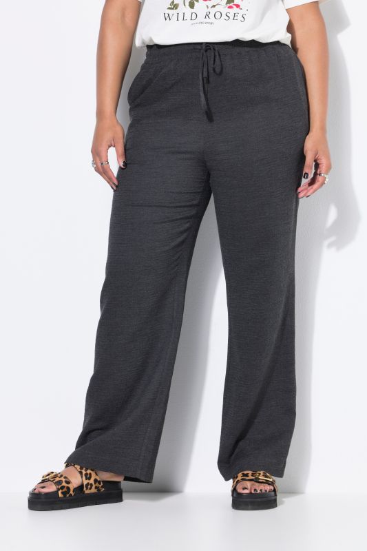 Pantalon finement texturé. Coupe Wide Legs, taille haute