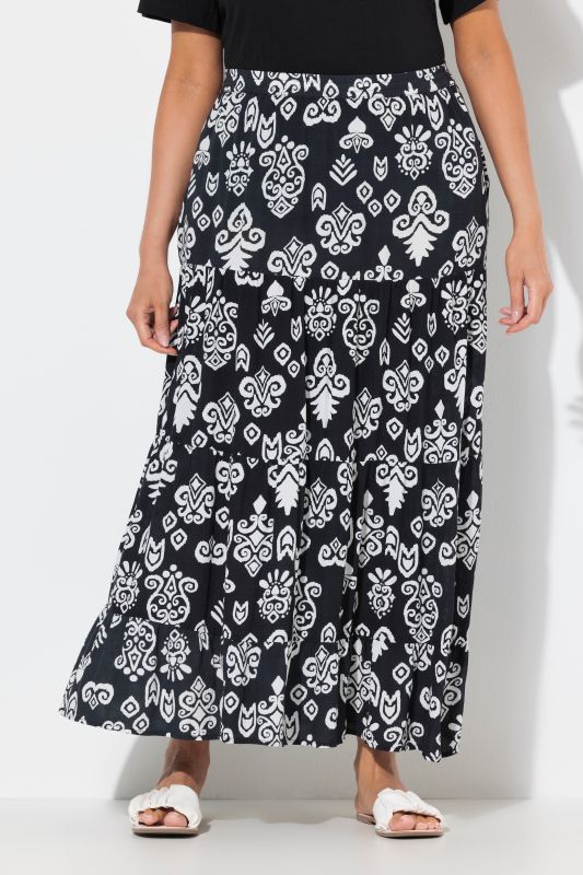 Jupe avec volants et poches. Taille élastique. Coupe évasée
