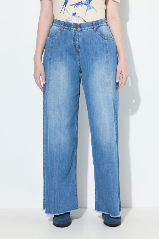 Jean Mary en denim stretch, jambe ultra-large et bas de jambe frangé