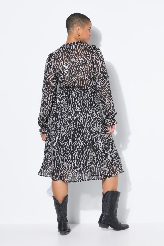 Robe midi, coupe évasée. Manches longues. Imprimé all-over