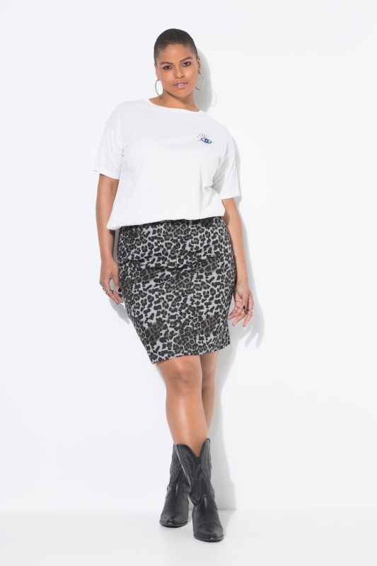 Jupe en jean, coupe évasée. Taille élastique. Motif léopard