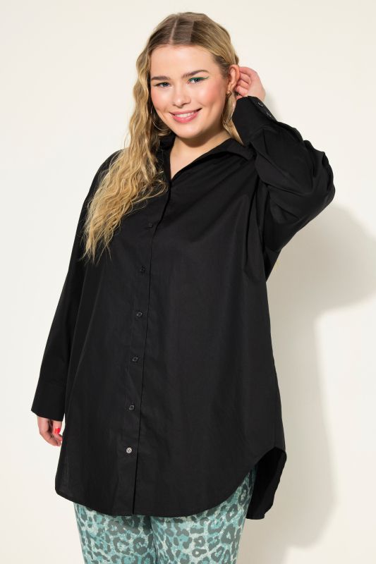 Bouse oversized à manches longues. Patte de boutonnage au dos