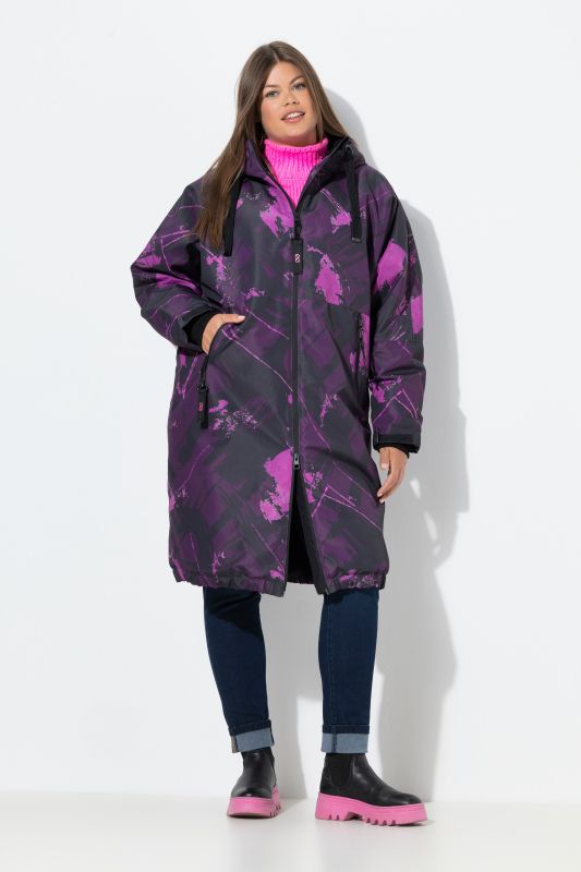 Veste technique oversize imprimée. Doublure polaire bouclée. Capuche