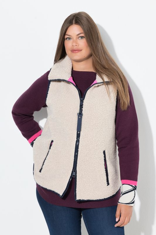 Gilet en polaire bouclée. Col montant, fermeture zippée