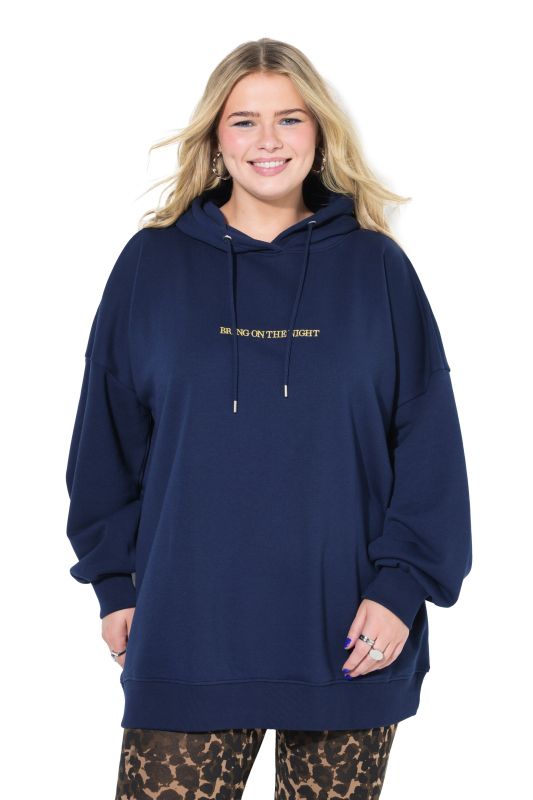 Sweat à capuche oversize. Message scintillant