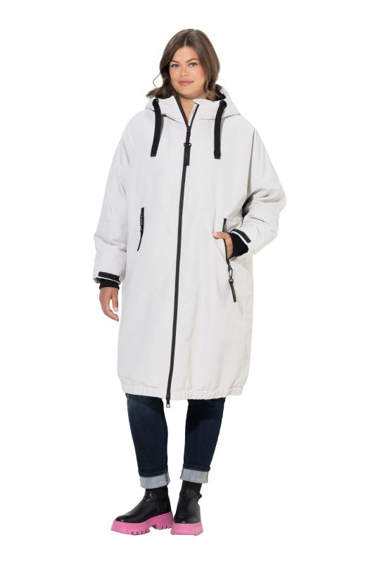 Veste technique oversize à capuche. Doublure polaire bouclée. Fermeture éclair à double sens