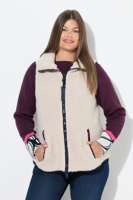 Gilet en polaire bouclée. Col montant, fermeture zippée