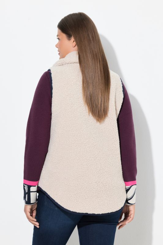 Gilet en polaire bouclée. Col montant, fermeture zippée