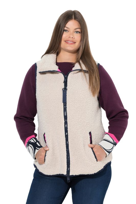 Gilet en polaire bouclée. Col montant, fermeture zippée