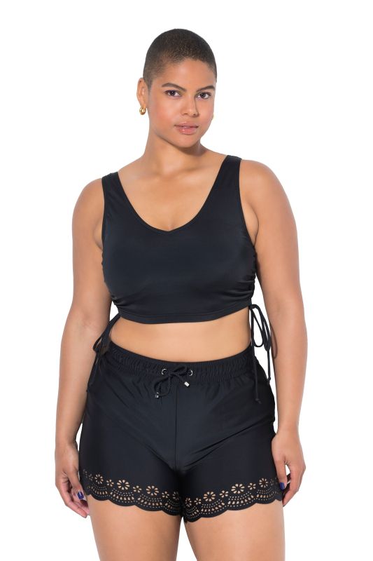 Short de bain à taille élastique. Jambe large et découpes au laser