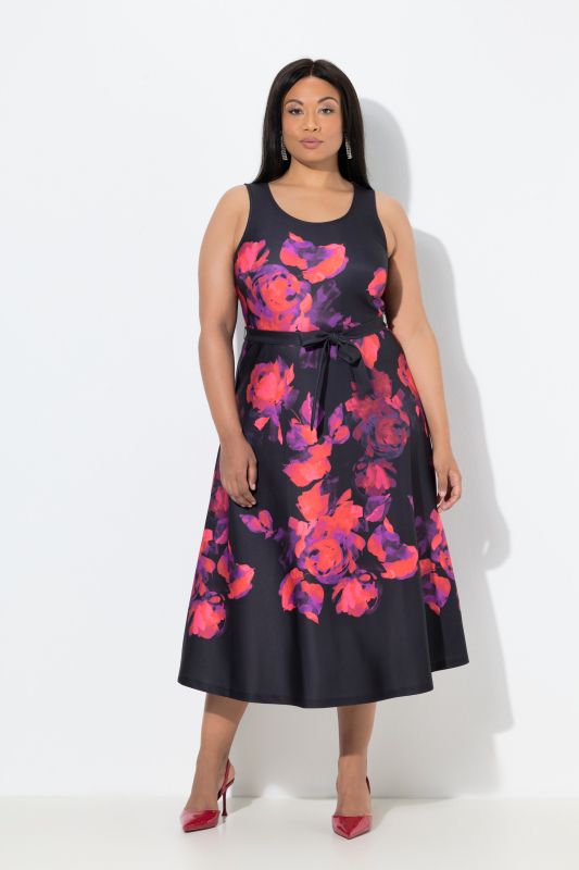 Robe maxi en tissu scuba sans manches à fleurs. Coupe trapèze
