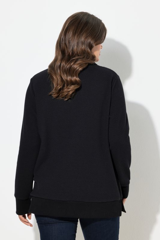 Sweat à col montant. Manches longues. Textile jacquard