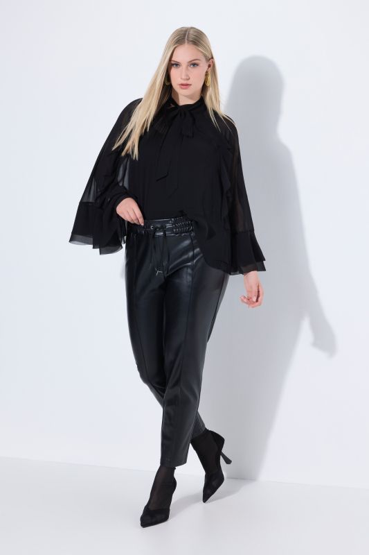 Pantalon 7/8 en similicuir. Passepoils et taille élastique
