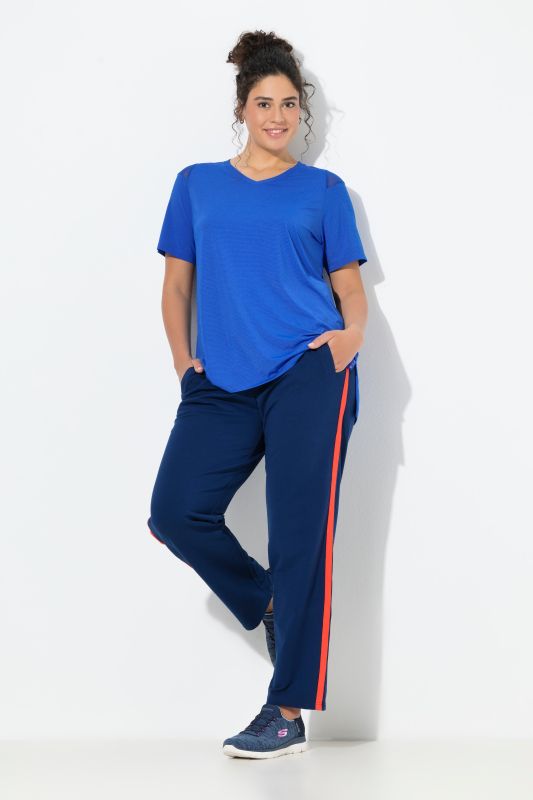 Pantalon de jogging, jambe droite. Bande colorée sur les côtés. Cordon de serrage à la taille.