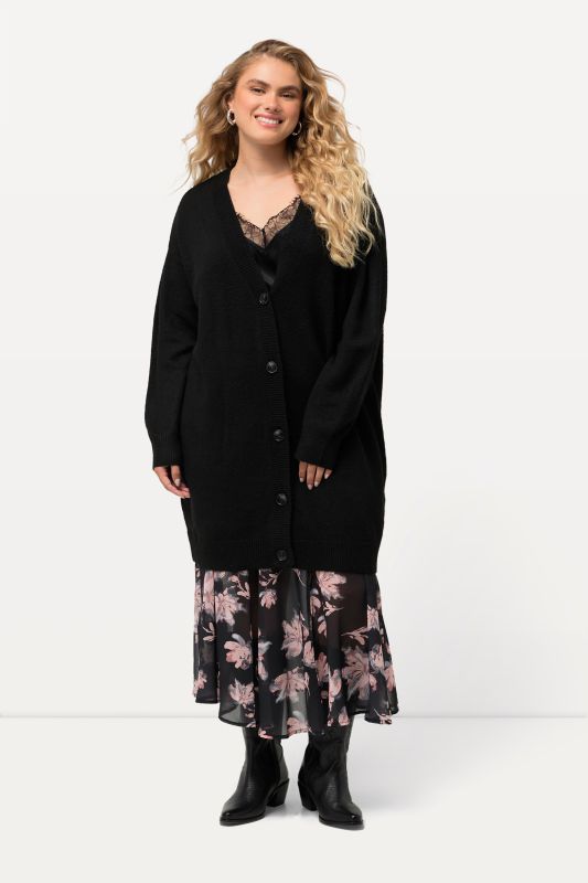 Cardigan en maille fine, profonde encolure en V et patte de boutonnage. Coupe Boxy Fit.
