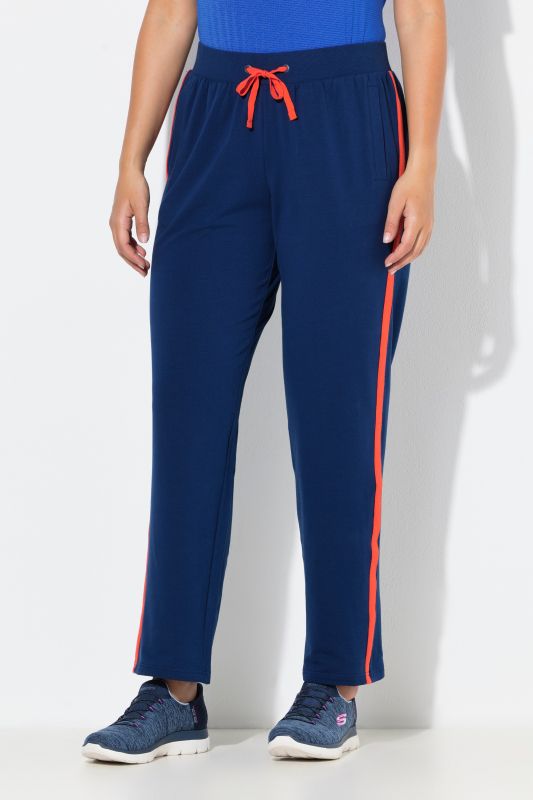 Pantalon de jogging, jambe droite. Bande colorée sur les côtés. Cordon de serrage à la taille.