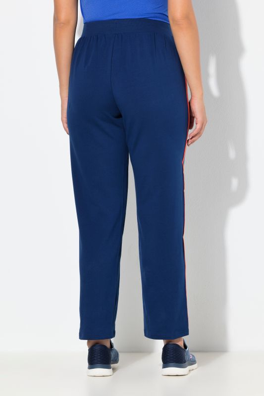 Pantalon de jogging, jambe droite. Bande colorée sur les côtés. Cordon de serrage à la taille.