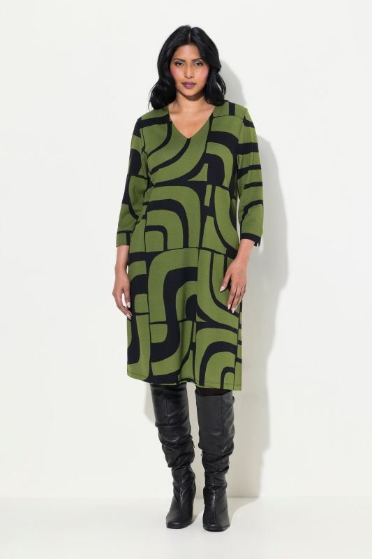 Robe en point de Rome, coupe évasée, décolleté en V, manches 3/4 et poches