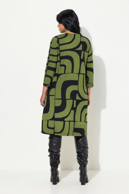 Robe en point de Rome, coupe évasée, décolleté en V, manches 3/4 et poches