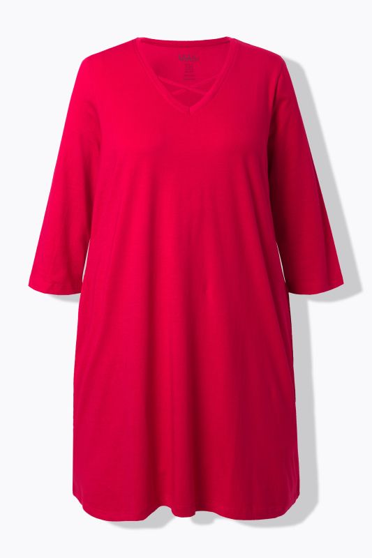 T-shirt long, coupe évasée. Manches 3/4, col V à rubans fantaisie