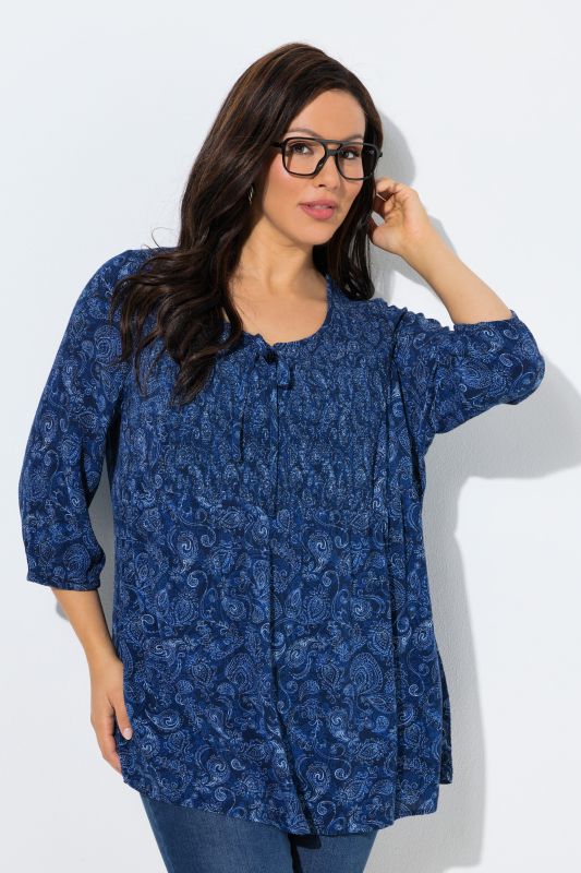 Blouse smockée, décolleté rond et manches 3/4, pli d'aisance dans le cos