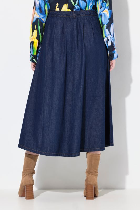 Jupe en jean, coupe évasée. Taille élastique. Boutons fantaisie