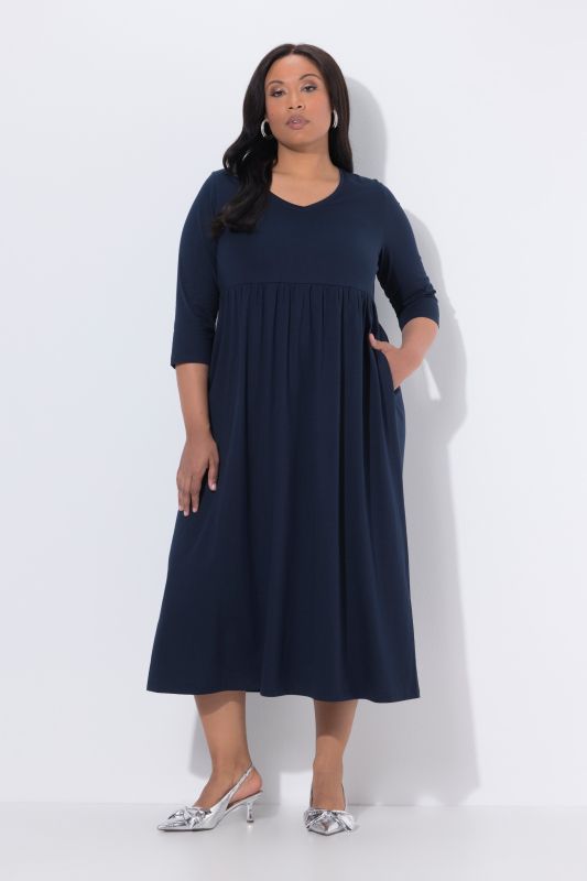 Robe en jersey avec poches, couture empire, décolleté en V et manches 3/4