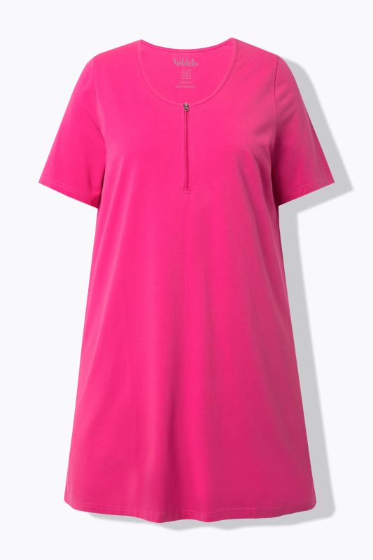 T-shirt long à fermeture zippée. Décolleté rond, manches courtes. Coupe évasée