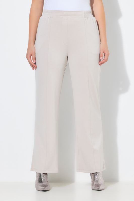 Pantalon en molleton, jambe large et droite, passepoils et taille élastique