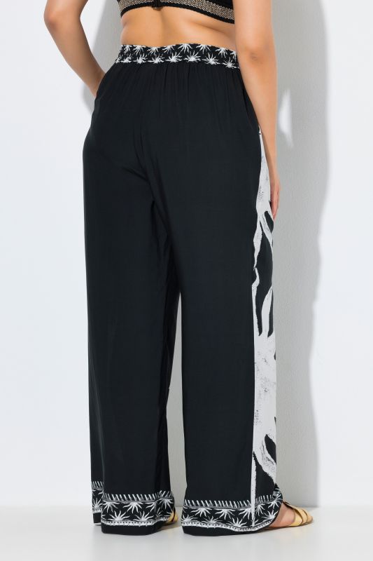 Pantalon palazzo, motif soleils, jambe large et taille élastique