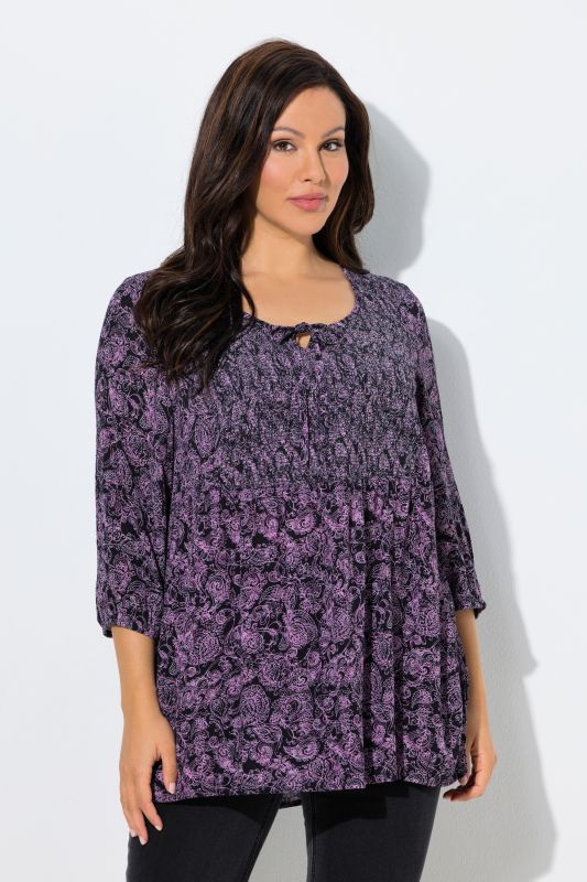 Blouse smockée, décolleté rond et manches 3/4, pli d'aisance dans le cos