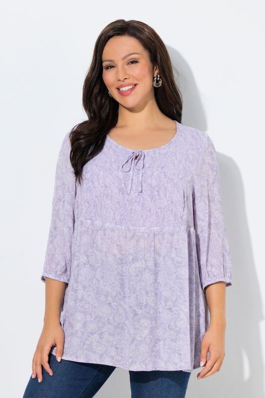 Blouse smockée, décolleté rond et manches 3/4, pli d'aisance dans le cos