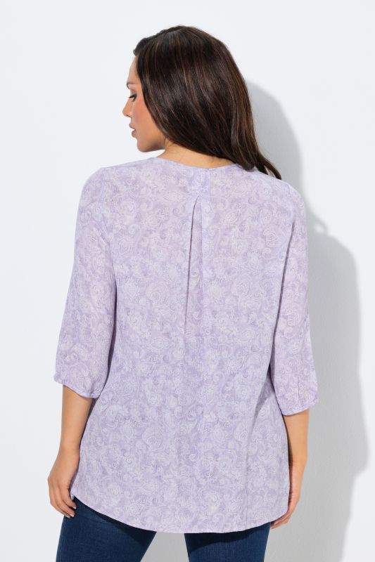 Blouse smockée, décolleté rond et manches 3/4, pli d'aisance dans le cos