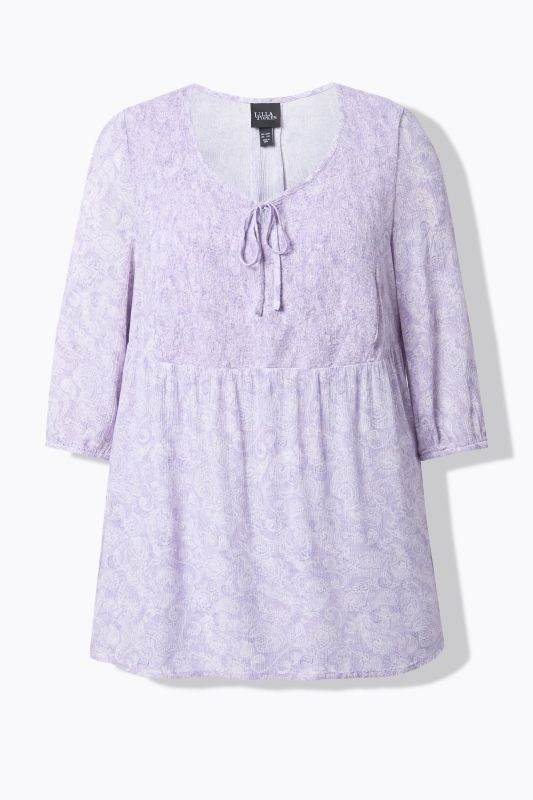 Blouse smockée, décolleté rond et manches 3/4, pli d'aisance dans le cos