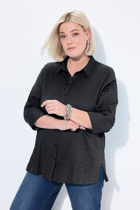 Chemisier en tissu gaufré. Col classique et manches 3/4