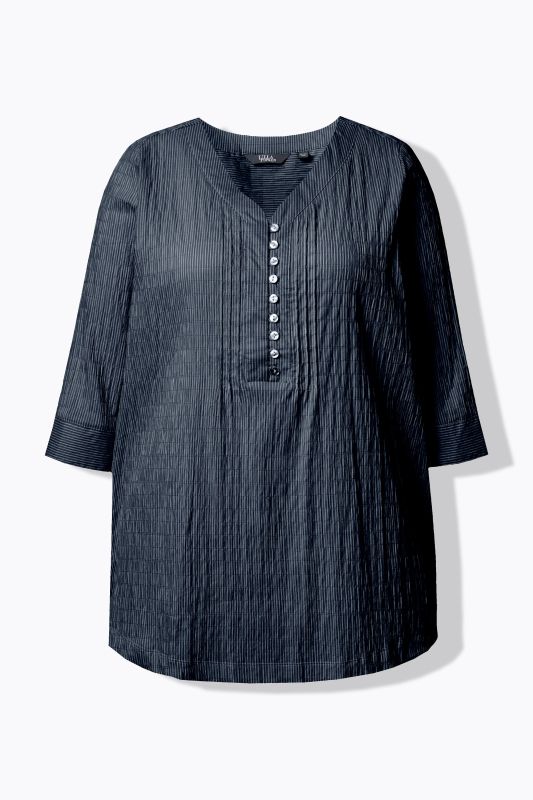 Tunique en tissu gaufré. Manches 3/4. Décolleté cœur et plis fantaisie