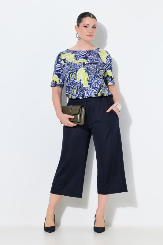 Jupe-culotte en maille fluide. Longueur mollet, jambe large. Taille élastique