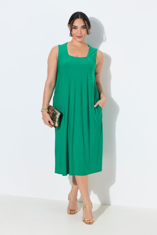 Robe en jersey, sans manches. Décolleté carré. Coupe évasée