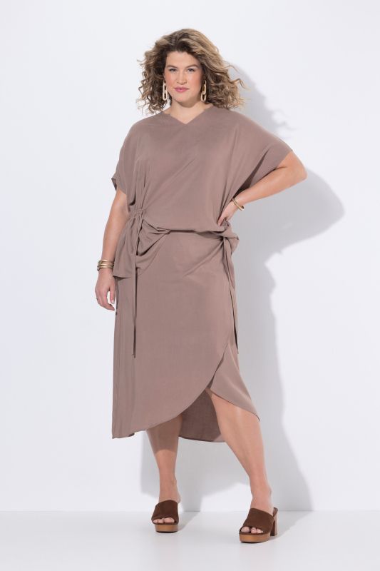 Jupe portefeuille, plus longue à l'arrière, taille élastique et coupe évasée