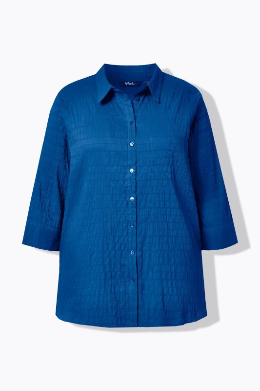 Chemisier en tissu gaufré. Col classique et manches 3/4