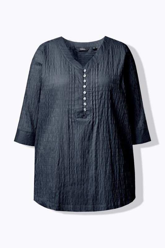 Tunique en tissu gaufré. Manches 3/4. Décolleté cœur et plis fantaisie