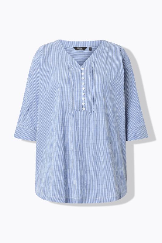 Tunique en tissu gaufré. Manches 3/4. Décolleté cœur et plis fantaisie