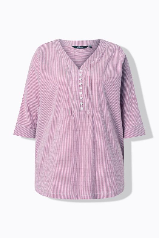 Tunique en tissu gaufré. Manches 3/4. Décolleté cœur et plis fantaisie