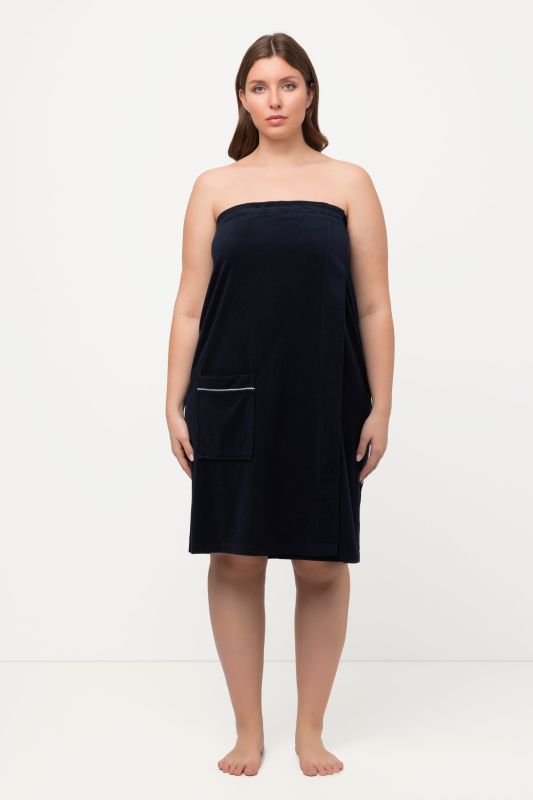 Robe sortie de bain en éponge. Fermeture velcro. Bande élastique dans le dos