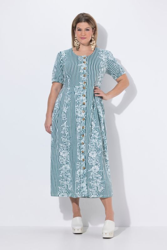 Robe maxi oversize en jersey. Décolleté rond et manches courtes. Imprimé à fleurs