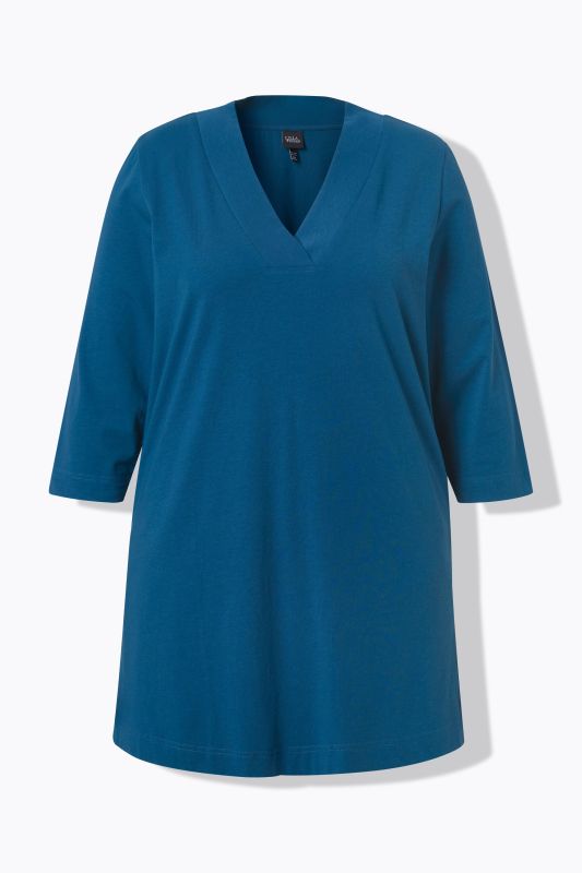 T-shirt long, coupe évasée. Décolleté en V et manches 3/4