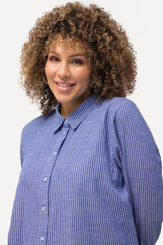 Chemisier long à rayures. Col classique, manches longues. Coupe évasée